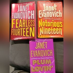 Janet Evanovich hardcover novels, used books plus bonus bumper stickers.